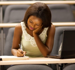 female african american university student sitting in lecture room